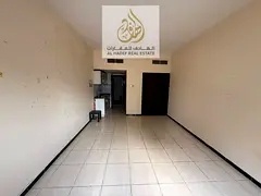 Large studio apartment with built-in wardrobes and a semi-separate kitchen in Al Rashidiya 3, near t
