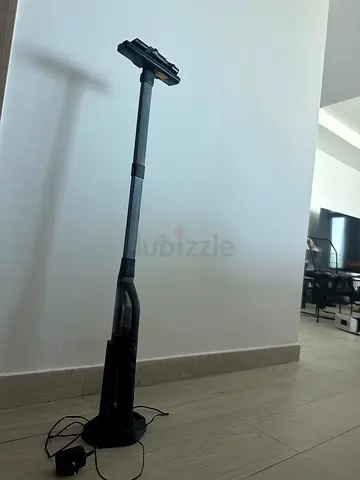 Lightweight cordless stick vacuum with charging dock — good condition