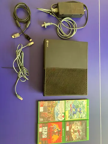 Xbox One console with 4 games. NO controllers.