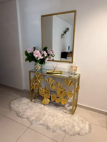 Mirror and decorative gold table set with free fur rug