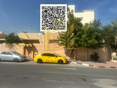 For sale in Ajman, Al Nuaimiya area, a traditional Arabic house on a corner lot with two street fron