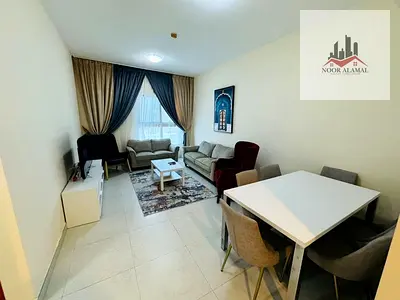 Sharjah, Al Taawun area: Two-bedroom apartment with a living room, kitchen, two bathrooms, and a balcony. Second tenant. Super deluxe furnishings. Lak