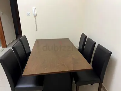 Wooden Dining Table with 6 Black Faux Leather Chairs - Good Condition