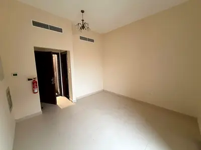 Studio apartment for annual rent in Al-Aliya, with a separate kitchen and balcony.