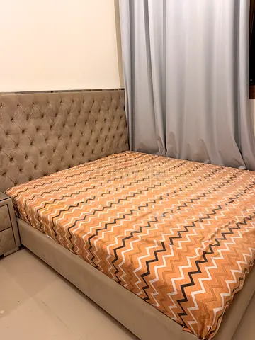 King-sized tufted upholstered bed with mattress and 2 side cupboards