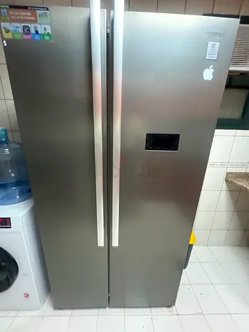 Large stainless steel double-door refrigerator with water dispenser