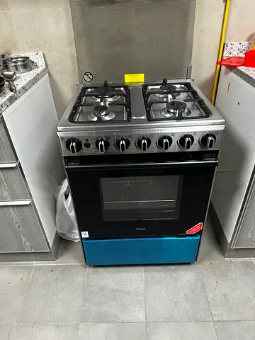 Used only for one month Midea 4-Burner Gas Cooker with Oven,Washing Machine and Refrigerator.