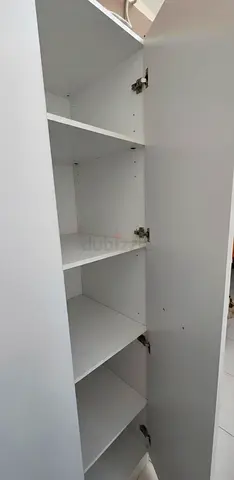 Storage Cabinet and king bed with Mattress and 1 side table. Negotiable