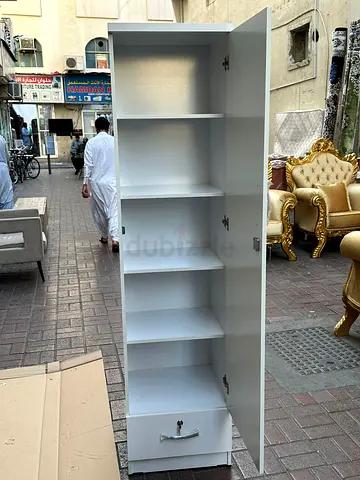 Slim White Storage Cabinet with Shelves and Drawer