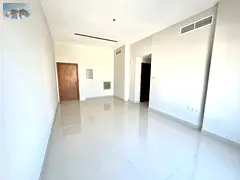 For annual rent in Ajman: a two-bedroom apartment with a living room, two bathrooms, and central air