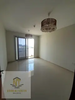 An apartment for annual rent, one room, a hall, a bathroom, and a balcony with an open view. A down