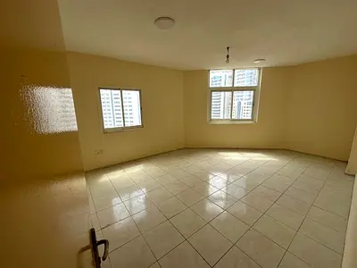 Two-bedroom apartment for annual rent in Al Majaz 2| 2 bathrooms | Kitchen | Balcony | Spacious living room | Next to the lake and Al Majaz Park, cen