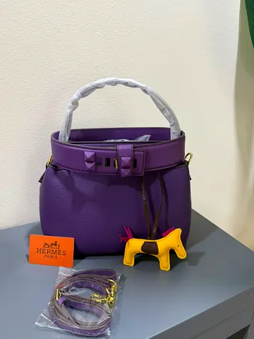 Purple Hermes-style Leather Handbag with Strap and Charm