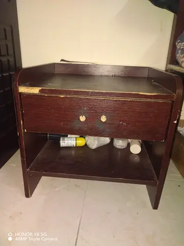 Used wooden bedside table with drawer