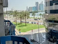Luxury two-bedroom apartment for rent in Al Majaz 3, 2 bathrooms, balcony, central gas, 40,000 AED a