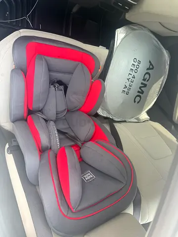 Used convertible child car seat — grey with red trim (good condition)
