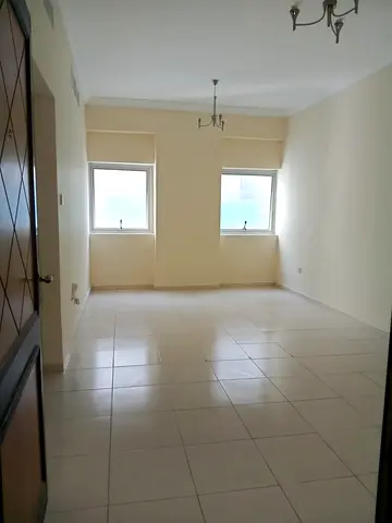 2 bedroom apartment Al Qasimia central AC clean building prime location close to services comfortable living good price deal