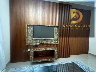 Two-bedroom apartment with a living room for rent in Al Taawun