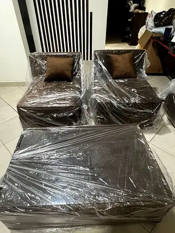 Brown Leather Sofa Set with Ottoman - Like New (wrapped) 2 single sofa with one table with cushions