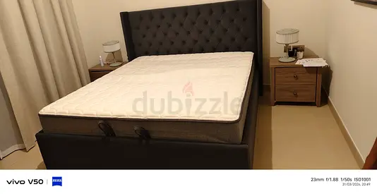 Dark Upholstered Double Bed and Headboard