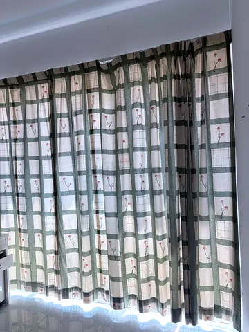 fabric curtains (green check with floral accents)