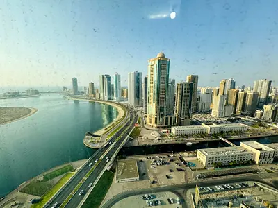 Free air conditioning | Parking, gym & swimming pool | Open view of Al Qasba | Near Dubai exit | On Al Khan Beach