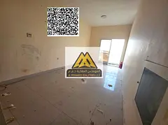 A spacious studio for annual rent in Al Hamidiya – Ajman, featuring a balcony with an open view in
