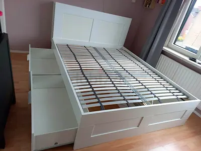 Ikea King Brimines bed frame with Ikea mattress and four storage drawers underneath