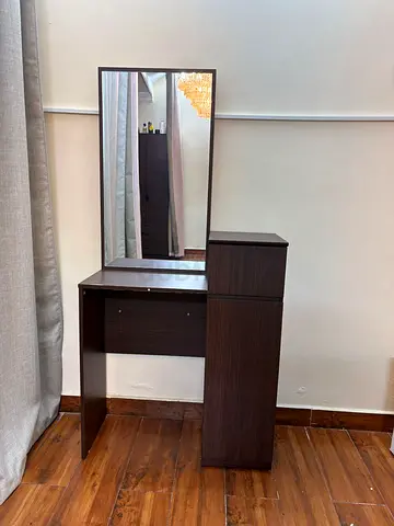 Compact dark wood dressing table with mirror and storage cabinet