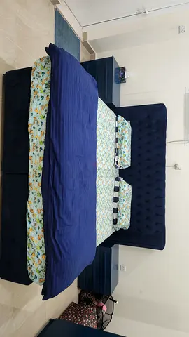 Blue Velvet Tufted king Bed with Headboard, 3 door wardrobe, 2 side tables and mattress.