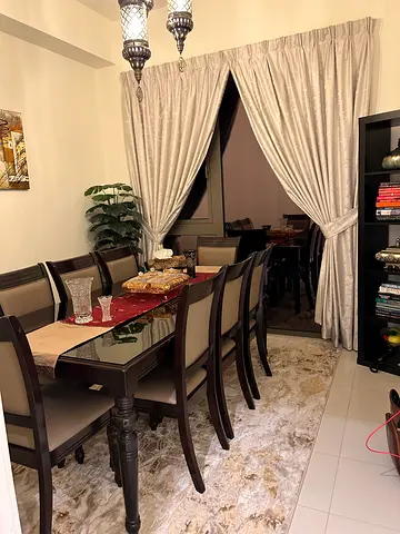 Wooden 8 Seater Dining Table with glass top and Chairs - Very Good Condition for immediate selling.