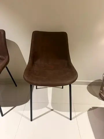 Brown suede dining chairs with black metal legs
