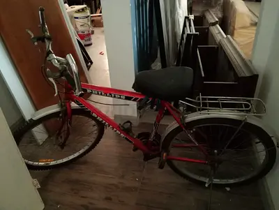 Red city/commuter bicycle with rear rack - used