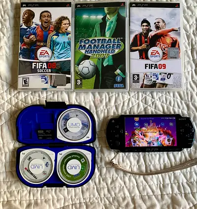 PSP 2000 Series with 3 UMD Games + 2GB Memory Card + UMD Case.