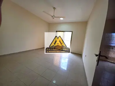 Easy access to Dubai and Sharjah: Two-bedroom apartment with a spacious living room, open views, and convenient access.