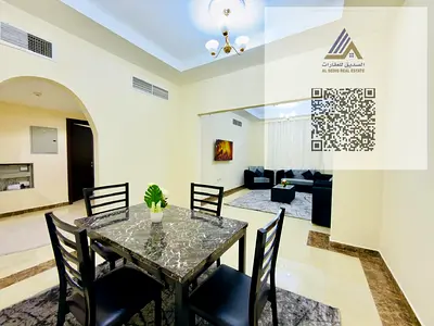Furnished Apartment for Rent (Al Rawda Area) in Ajman - One bedroom, living room, two bathrooms, balcony, central air conditioning.