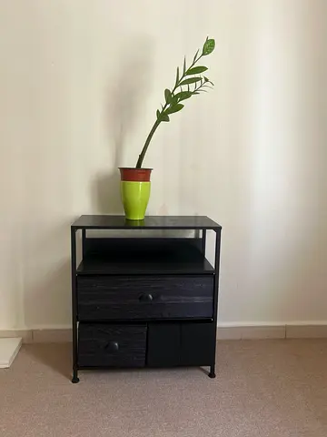 Small black bedside table with 3 drawers and metal frame