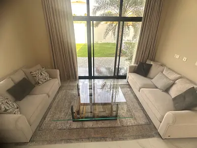 Pair of Light Beige Sofas with Glass Coffee Table (without carpet) very good Condition