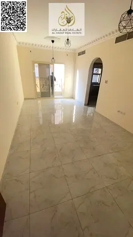 Two bedrooms, a living room, two bathrooms, a large area, a master bedroom with a balcony, close to Al-Aqsa School and Al-Hammadi Restaurant.