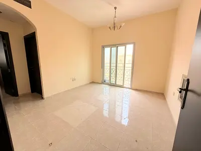 AMAZING 1BHK WITH BALCONY ON ROAD BUILDING IN MUWAILEH