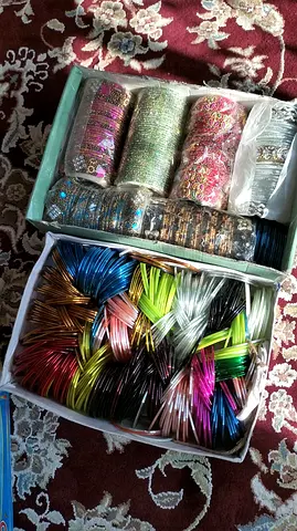 Box of assorted colorful womens bangles – various sizes and styles