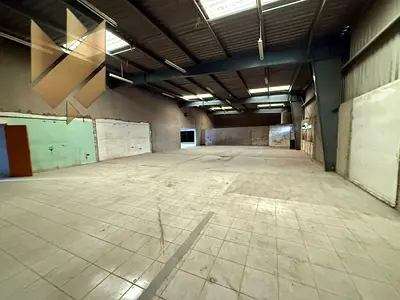 Warehouse for rent in Industrial Area 10 on a main street, with 110 kW electricity.