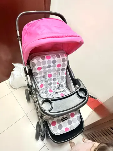 Pink baby stroller with tray and canopy - good condition