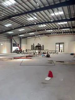 A huge industrial warehouse with a 230 kW power supply on a main street