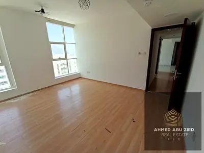 English: 2BR hall apartment for rent in Al Majaz 3, 2 baths, central AC, wardrobes, parking and gym, prime location, 55,000 in 4 payments, 2000 deposi