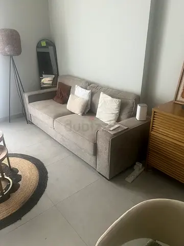 Compact shaped grey fabric sofa — good condition