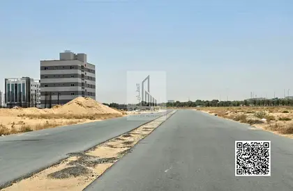 Commercial land plot in a prime location in Global City development in Al-Aliya