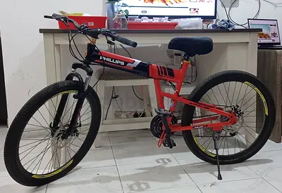 Red Phillips Mountain Bike - 21 Speed, Front Suspension, Good Condition