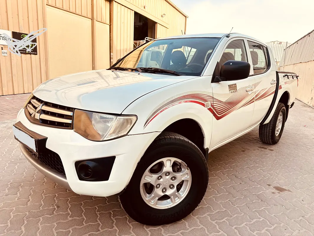 Mitsubishi L200 2010 — photo 1 of 16