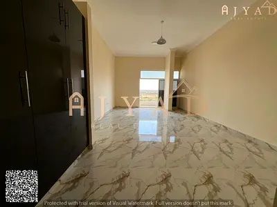 For rent: 2 bedrooms hall in Al Mowaihat 3 Ajman, Academy Street, first occupancy, 2 bedrooms, built-in wardrobes, balcony, central AC, 2 bathrooms